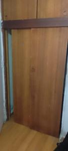 a close up of a wooden door in a room at José Coro in La Serena