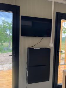 a flat screen tv hanging on a wall at Piva Chill in Plužine