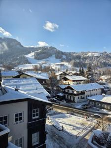 arial view of a town with snow covered buildings at Resi´s Stadthaus in Kitzbühel
