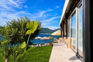 a house with a view of the ocean at Luxury Sea Residence by Kristina in Tivat