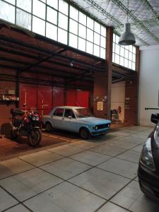 a car parked in a garage next to a motorcycle at Complejo las Catalinas Dto 1 A in Puerto Madryn