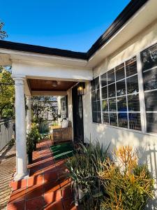 a front porch of a house with a porch at The Ardmore Home Share in Los Angeles