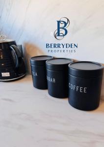 a group of three coffee cups sitting on a counter at Aalesund stay in Peterhead