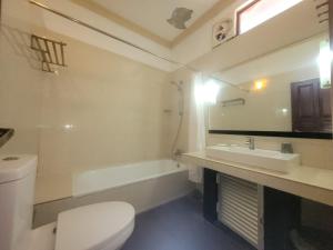a bathroom with a toilet and a sink and a tub at Vintara Wild Hambanthota in Hambantota +95 photos