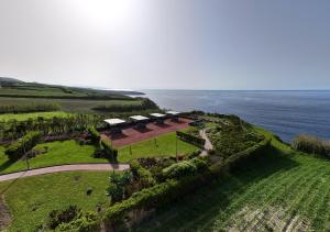 an aerial view of a farm next to the ocean at Recanto Vital in Achadinha