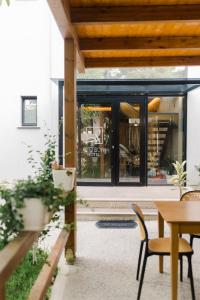 an internal view of a house with a table and chairs at Ritson Hotel in Vlorë