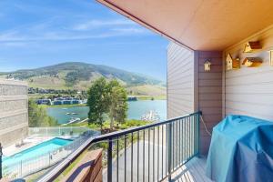 a balcony with a view of a lake and mountains at Marina Place 137 in Dillon