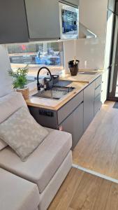 a kitchen with a sink and a counter top at Duerme en un barco in Moaña