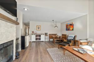 a living room with a couch and a fireplace at Pine Acres 122 - Halfway to Heaven in Durango