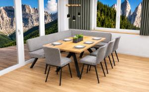 a dining room with a wooden table and chairs at Wolf Apartments in Ladis