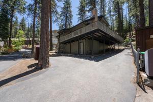 a building in the middle of a forest at Foothill Folly home in Zephyr Cove