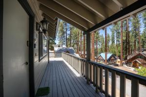 a porch with a view of a cabin at Foothill Folly home in Zephyr Cove