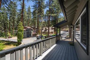 an empty porch of a house with trees at Foothill Folly home in Zephyr Cove +48 photos
