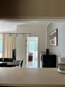 a kitchen and living room with a table and chairs at dana beach resort in Half Moon Bay