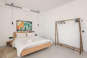 a bedroom with a bed in a white room at The blue Mirage II in Tangier