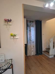 a room with a hallway with a door and a window at Romantic house by the River in Pfaffenhoffen +54 photos