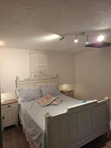 a bedroom with a large bed in a room at Romantic house by the River in Pfaffenhoffen