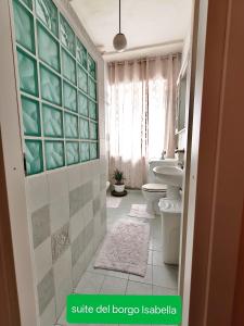 a bathroom with a toilet and a sink at suite del borgo in Turin