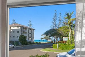 a view from a window of a beach at Kitchener Street 2, Golden Beach in Golden Beach
