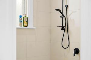 a shower with a shower head in a bathroom at 496 Classic Character Home with Charm in Perth +30 photos