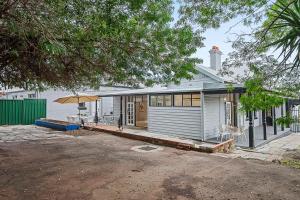 a house with a garage and an umbrella at 496 Classic Character Home with Charm in Perth
