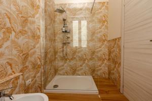 a bathroom with a bath tub and a sink at B&B Abbazia di Piona in Colico