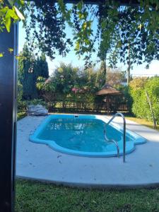 a swimming pool in a yard with abent at El Encuentro in Sierra de los Padres