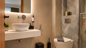 a bathroom with a sink and a toilet at Studios Maria - Renovating Brand New for 2026 in Potos