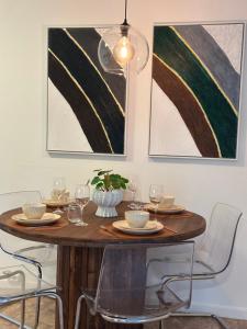 a dining room table with chairs and wine glasses at Villa Myklebust in Olden