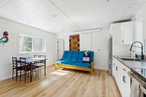 a kitchen with a blue couch and a table at Trails & Tranquility in Pagosa Springs +20 photos