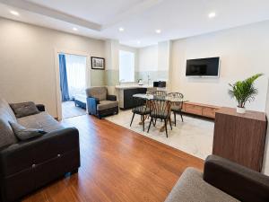 a living room with a couch and a table at Luna Hotel in Antalya