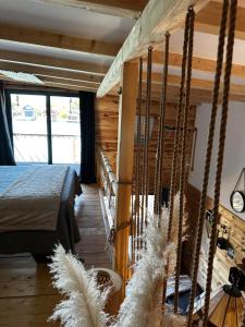 a bedroom with a bed and a swing at Meris in Ulcinj