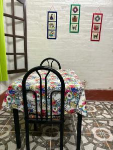 a table with a table cloth on top of a chair at Monoambiente LPS in Santiago del Estero
