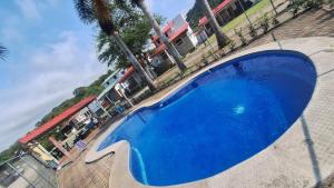 an overhead view of a large blue swimming pool at Cabaña Mar Olon Renovation in Olón