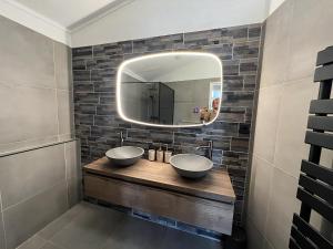 a bathroom with two sinks and a mirror at Aquaronde 108 in Lemmer +18 photos