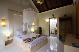 Postel nebo postele na pokoji v ubytování Villa Nusa