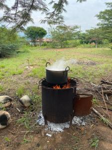a pot sitting on top of a fire at Cabañas Mastranto in Monterrey +28 photos