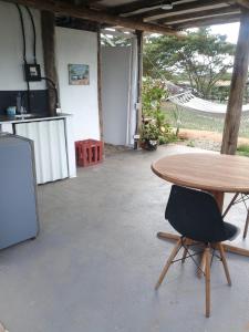 a table and a chair in a room with a kitchen at Cabañas Mastranto in Monterrey