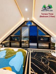 a room with a large window in a boat at Baguio Terrace Lodge in Baguio