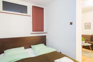 Posteľ alebo postele v izbe v ubytovaní ShortStayPoland Graniczna (B6)