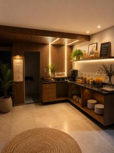 a lobby of a restaurant with a counter with plants at Hotel SP in Belém