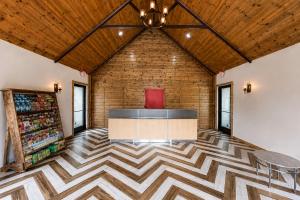a lobby with a checkered floor and a bar at Lodge at Mill Creek Pigeon Forge in Pigeon Forge