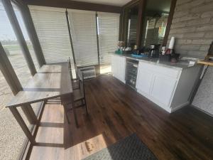 a kitchen with a table and a dining room at Rodeway Inn in Carthage +15 photos