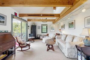 a living room with a couch and a table at GOPI Notch in Franconia