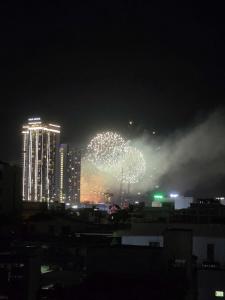 a firework display in a city at night at ZENITH STAY by Lan's in Danang