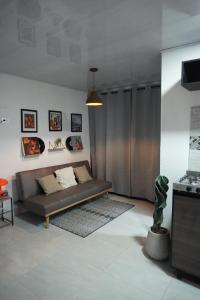 a living room with a couch and a table at Loft Del Ruiz - Apartamentos in Líbano