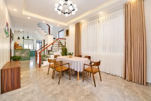 a dining room with a table and chairs at KP Villa Dalat in Da Lat