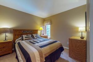 a bedroom with a large bed and two night stands at Autumn Foliage 209 in Breckenridge