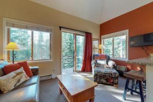 a living room with a couch and a table at Year Round Getaway 301 in Breckenridge