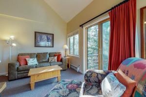a living room with a couch and a table at Year Round Getaway 301 in Breckenridge